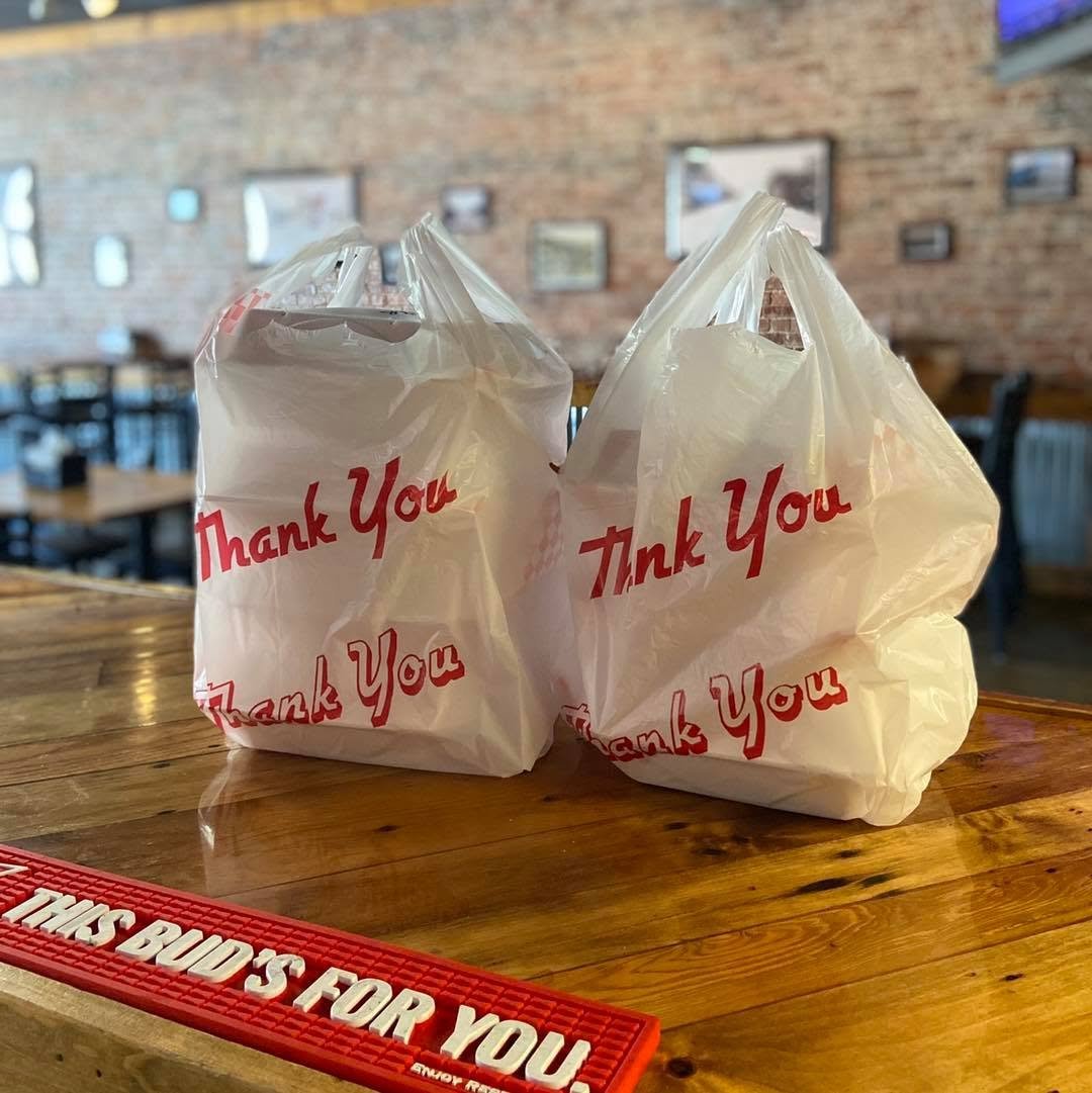 Ruby's to-go bags on the bar