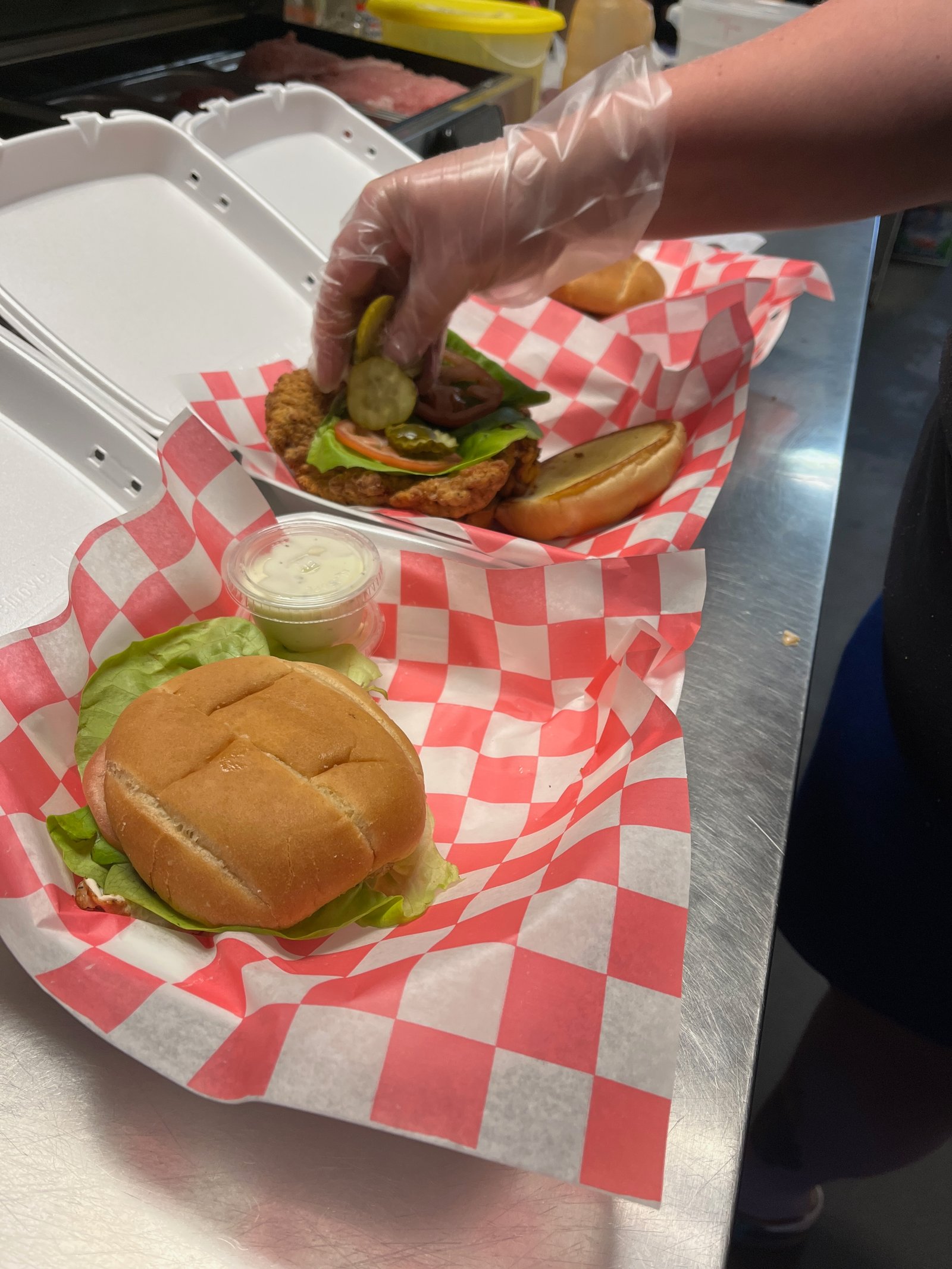 Kitchen prep -- tenderloin and burger being assembled